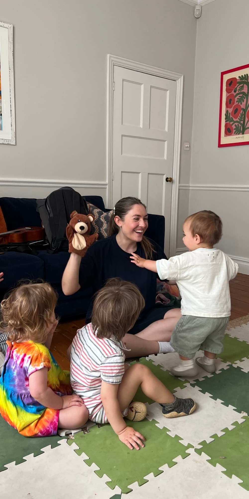 Lottie with a bear puppet captivating the children